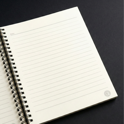 Open notebook with lined pages on a black background